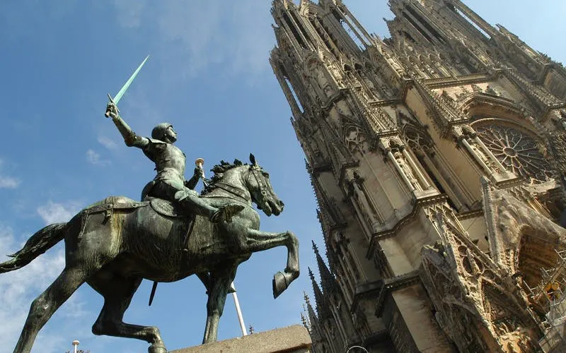 Equestrian statue near Reims Cathedral, France, part of self-guided city exploration game.
