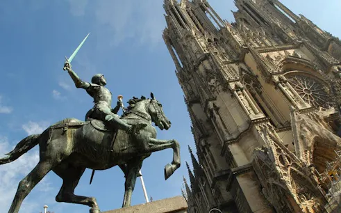 Equestrian statue near Reims Cathedral, France, part of self-guided city exploration game.