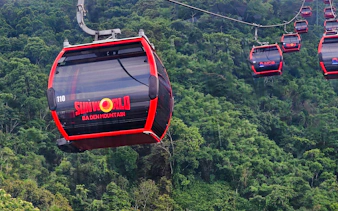 Cable car ascending Ba Den Mountain, lush greenery, Ho Chi Minh City tour.