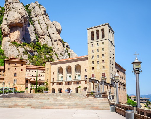 Montserrat Monastery nestled in rocky mountain landscape, Catalonia, Spain.