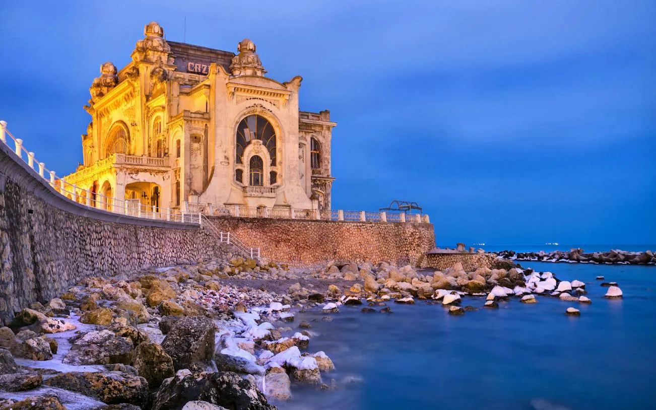 Constanta Casino by the Black Sea at dusk, part of the Haunted Constanta exploration game.