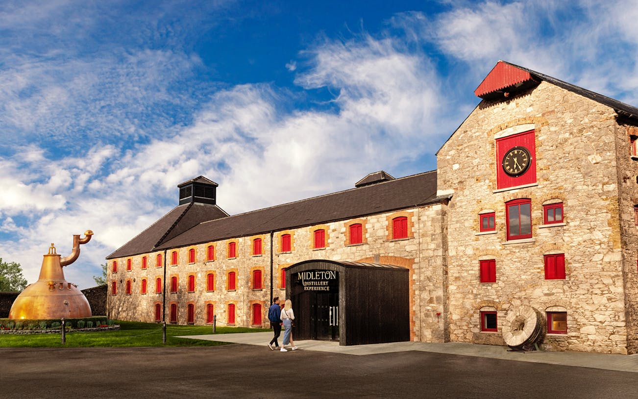 Midleton Distillery entrance with Jameson Irish Whiskey barrels, County Cork, Ireland.