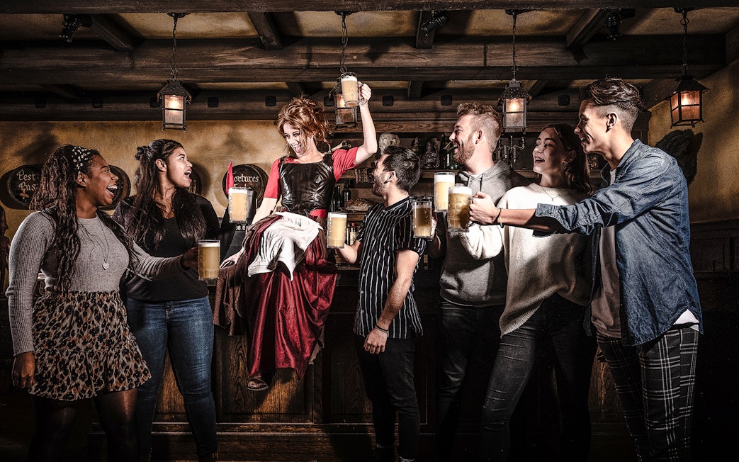 Guests enjoying drinks at the Amsterdam Dungeon bar.