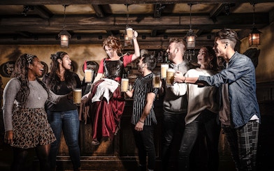 Guests enjoying drinks at the Amsterdam Dungeon bar.