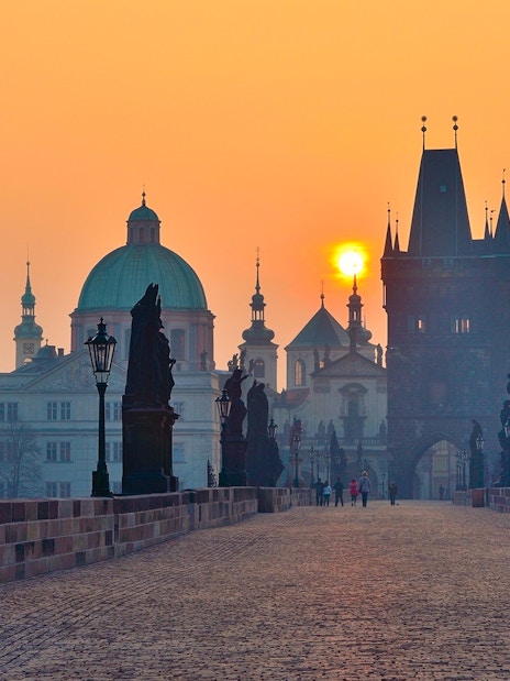 Charles Bridge at sunrise with statues, Prague.