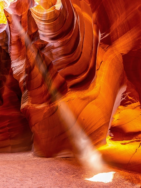 Upper Antelope Canyon sandstone formations with light beams in Arizona.