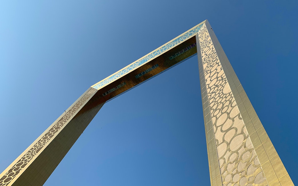 Close-up view of the Dubai Frame against a clear blue sky.
