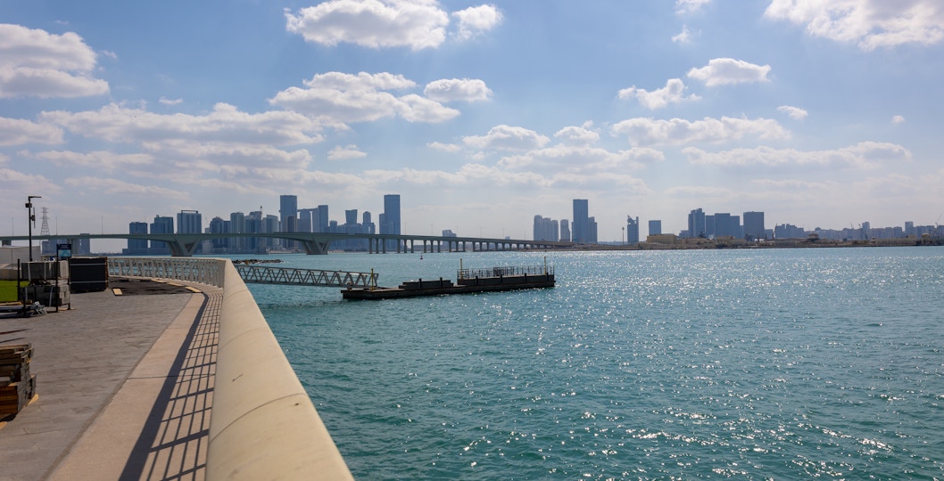 City skyline with towers and skyscrapers viewed from Saadiyat Island, Abu Dhabi.