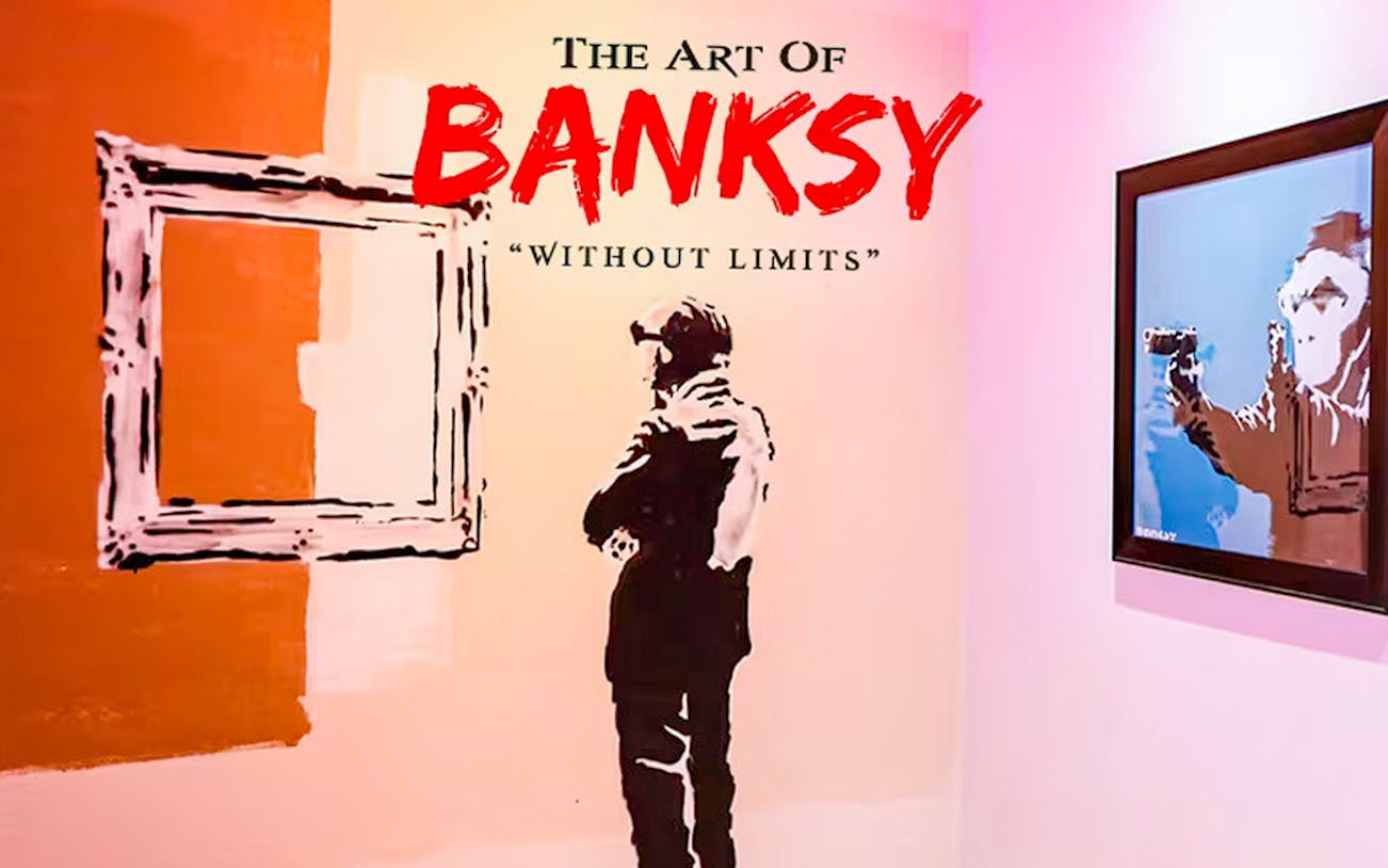 Banksy artwork display at "Without Limits" exhibition in Singapore.