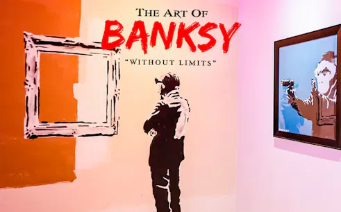 Banksy artwork display at "Without Limits" exhibition in Singapore.