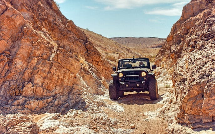 Jeep navigating rocky terrain during Cappadocia safari tour.
