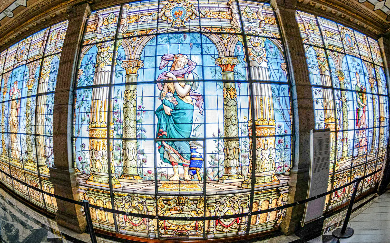Stained glass windows depicting classical figures inside Chapultepec Castle, Mexico City.