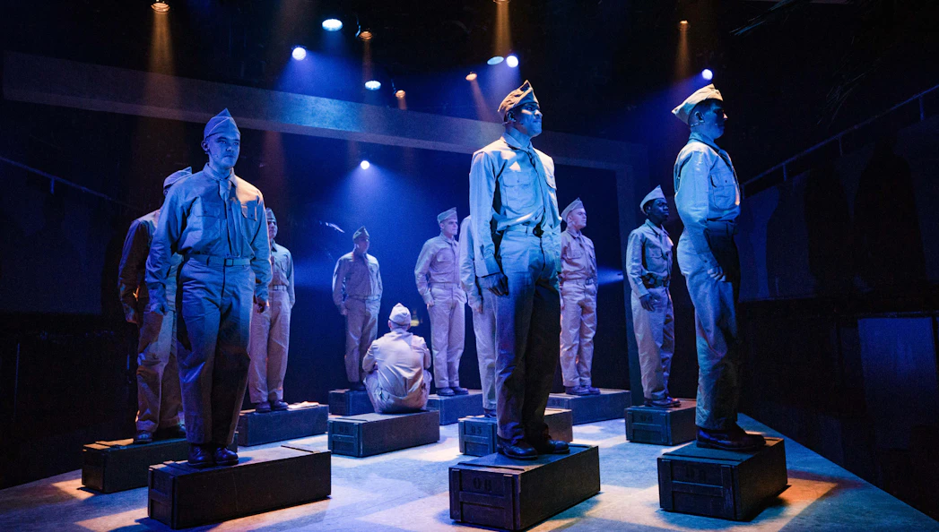 Soldiers in uniform perform on stage in "From Here To Eternity – The Musical.