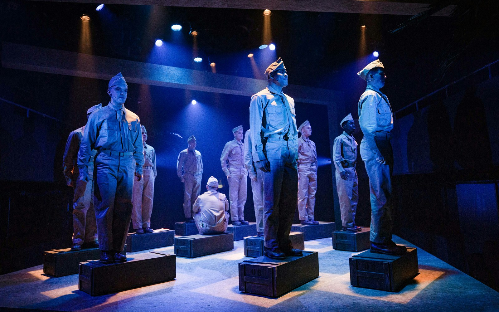Soldiers in uniform perform on stage in "From Here To Eternity – The Musical.