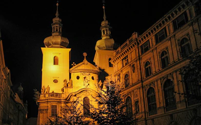 Historic Prague building illuminated at night, part of Ghosts and Legends tour.