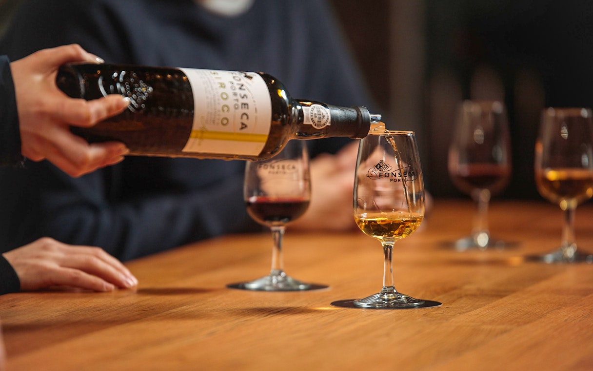 Pouring wine at Fonseca Port Wine Cellars tasting session.