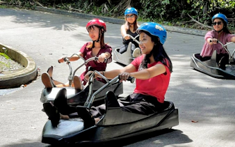 People enjoying a luge ride at Skyline Luge Kuala Lumpur.