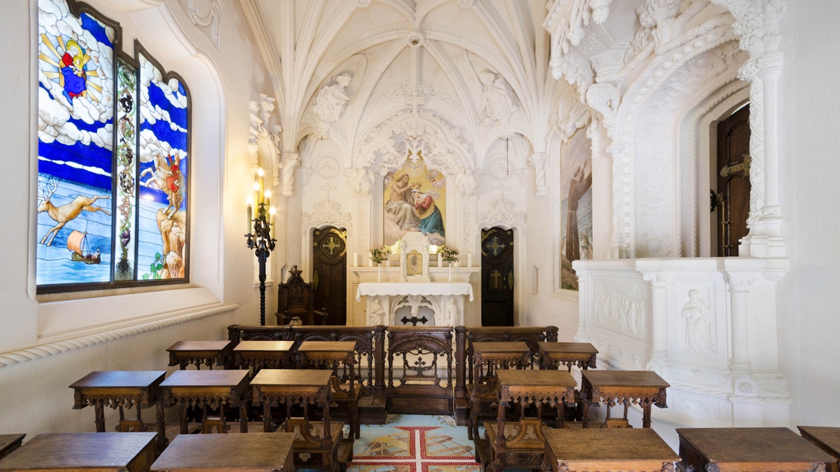 Quinta da Ragaleria Chapel interior with ornate ceiling and stained glass windows, Sintra, Portugal.