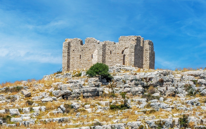 Old stone ruins on a rocky hill in Kornati National Park, Croatia.
