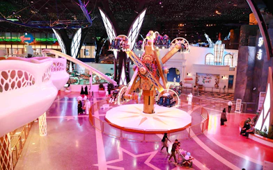 Doha Quest indoor theme park ride with visitors in Qatar.