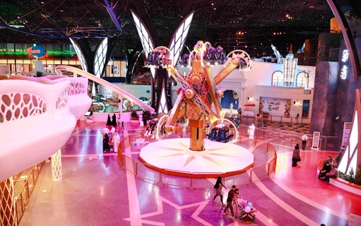 Doha Quest indoor theme park ride with visitors in Qatar.