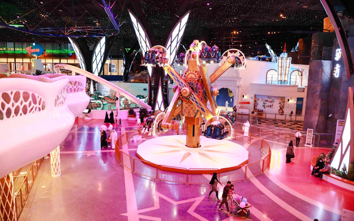 Doha Quest indoor theme park ride with visitors in Qatar.