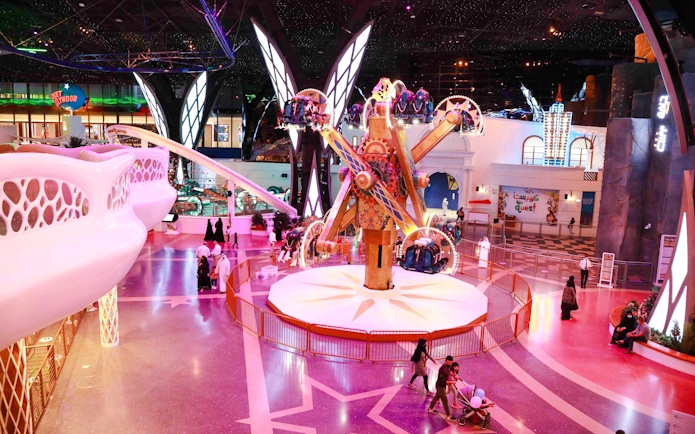 Doha Quest indoor theme park ride with visitors in Qatar.
