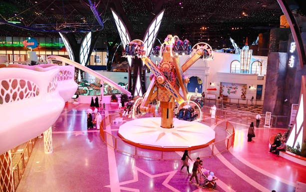 Doha Quest indoor theme park ride with visitors in Qatar.