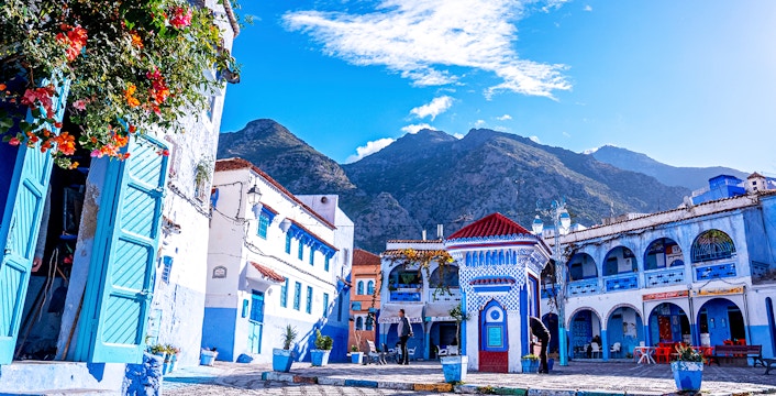 Chefchaouen's blue buildings and mountain backdrop on a full-day trip from Fez.