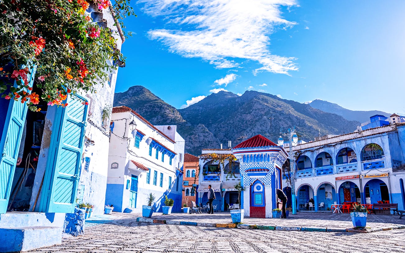 Chefchaouen's blue buildings and mountain backdrop on a full-day trip from Fez.