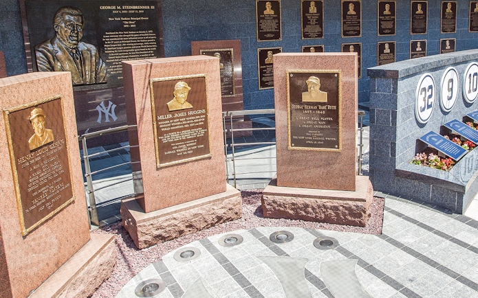 Yankees Monument Park plaques honoring Lou Gehrig, Miller Huggins, and Babe Ruth.
