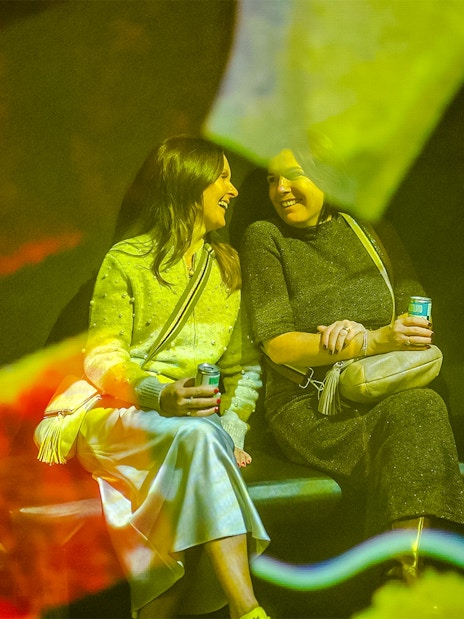 Visitors enjoying exhibit at Frameless Lates event.