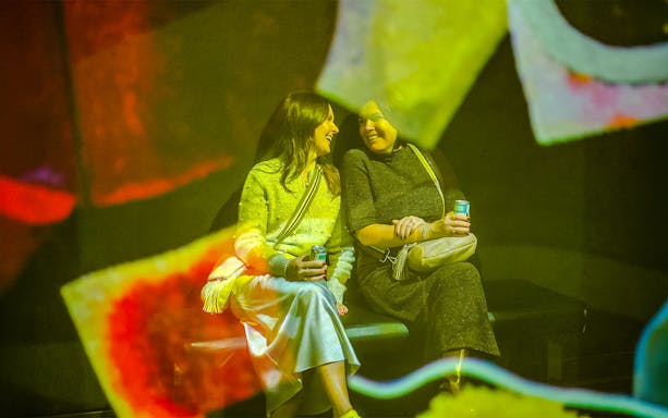 Visitors enjoying exhibit at Frameless Lates event.