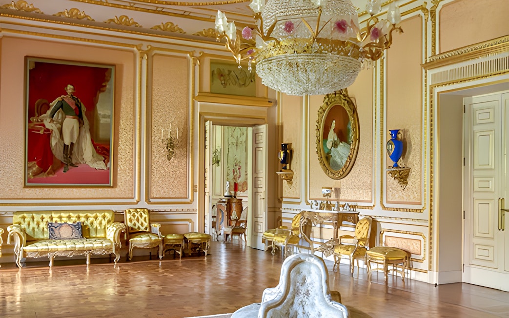 Liria Palace interior with ornate chandelier, gilded furniture, and classical paintings.