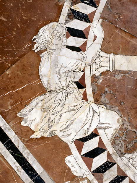 Marble inlay artwork on Siena Cathedral floor depicting a historical figure.