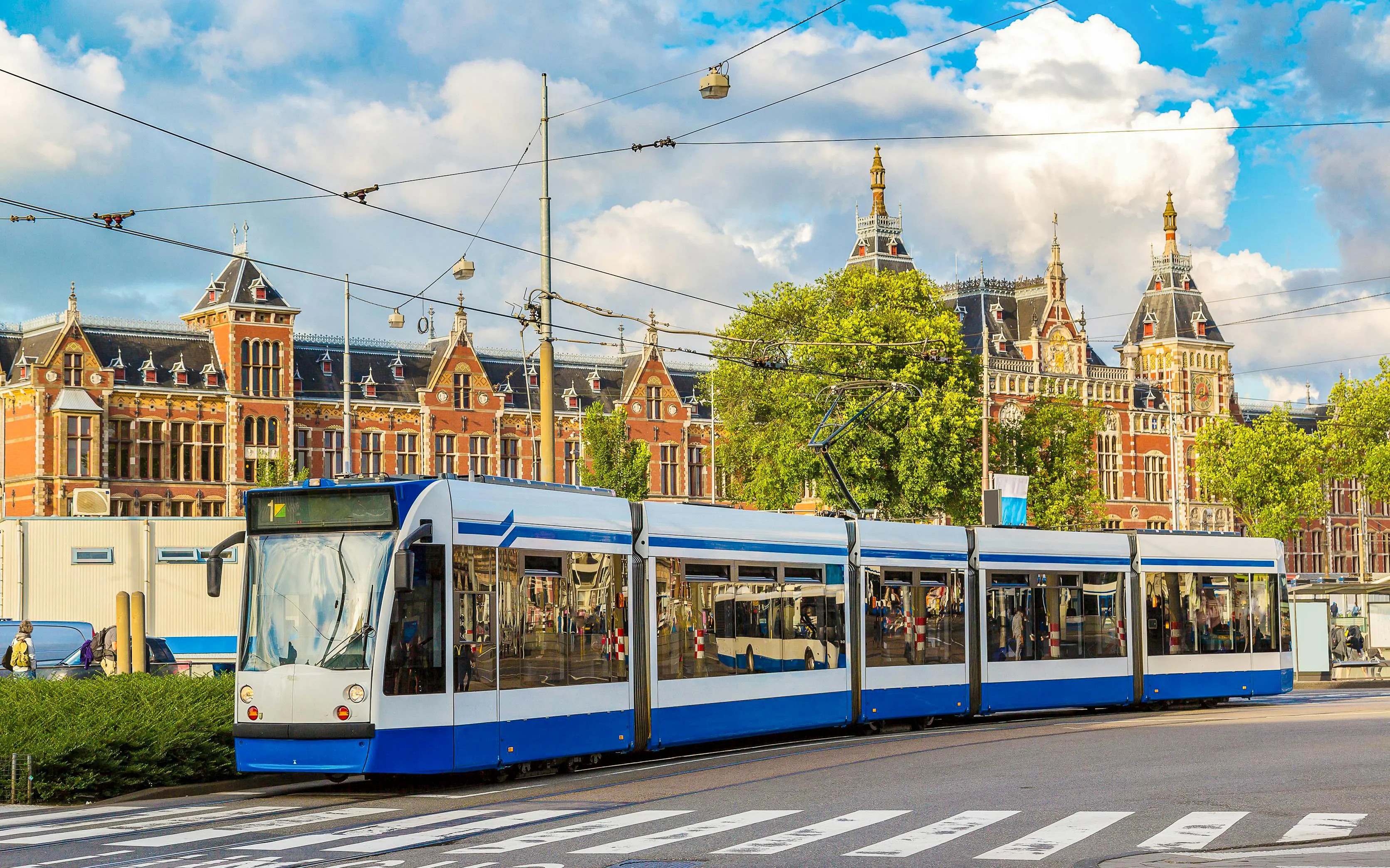 City tram passing by Amsterdam Central Station.