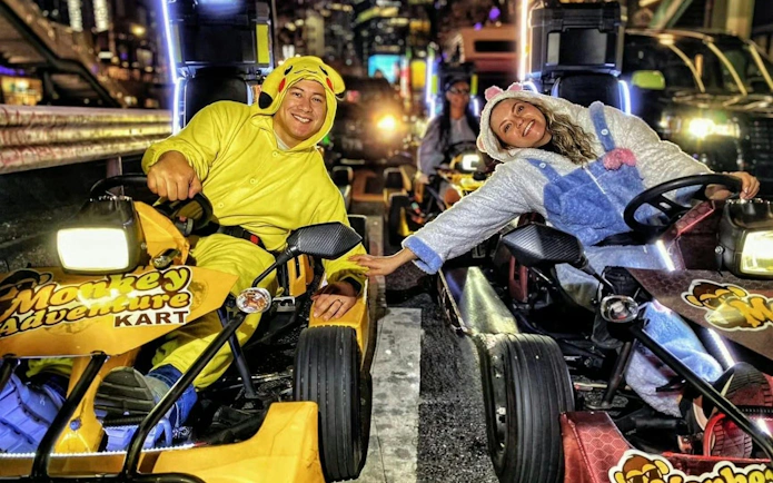 Go-kart riders in costumes at Shibuya Crossing during Tokyo Tower tour by Monkey Kart.