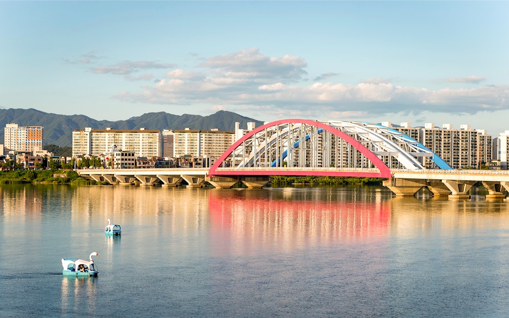 Soyang 2 Bridge over Chuncheon Lake with swan boats, Chuncheon, Korea.