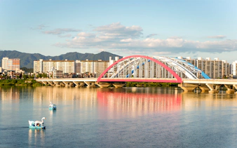 Soyang 2 Bridge over Chuncheon Lake with swan boats, Chuncheon, Korea.