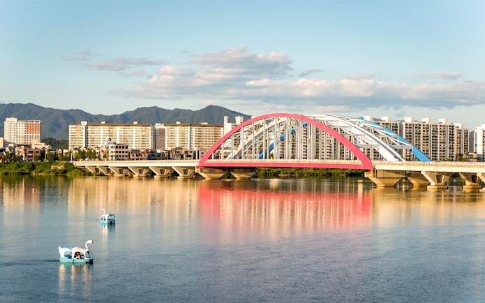 Soyang 2 Bridge over Chuncheon Lake with swan boats, Chuncheon, Korea.