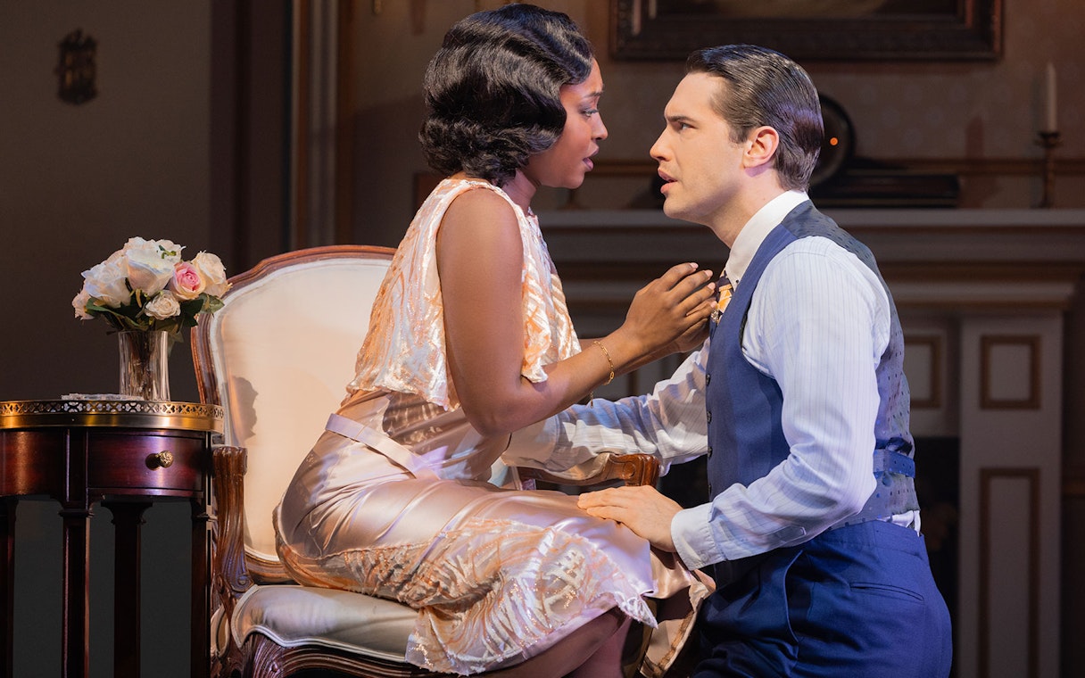 Actors in a dramatic scene from The Great Gatsby stage production.