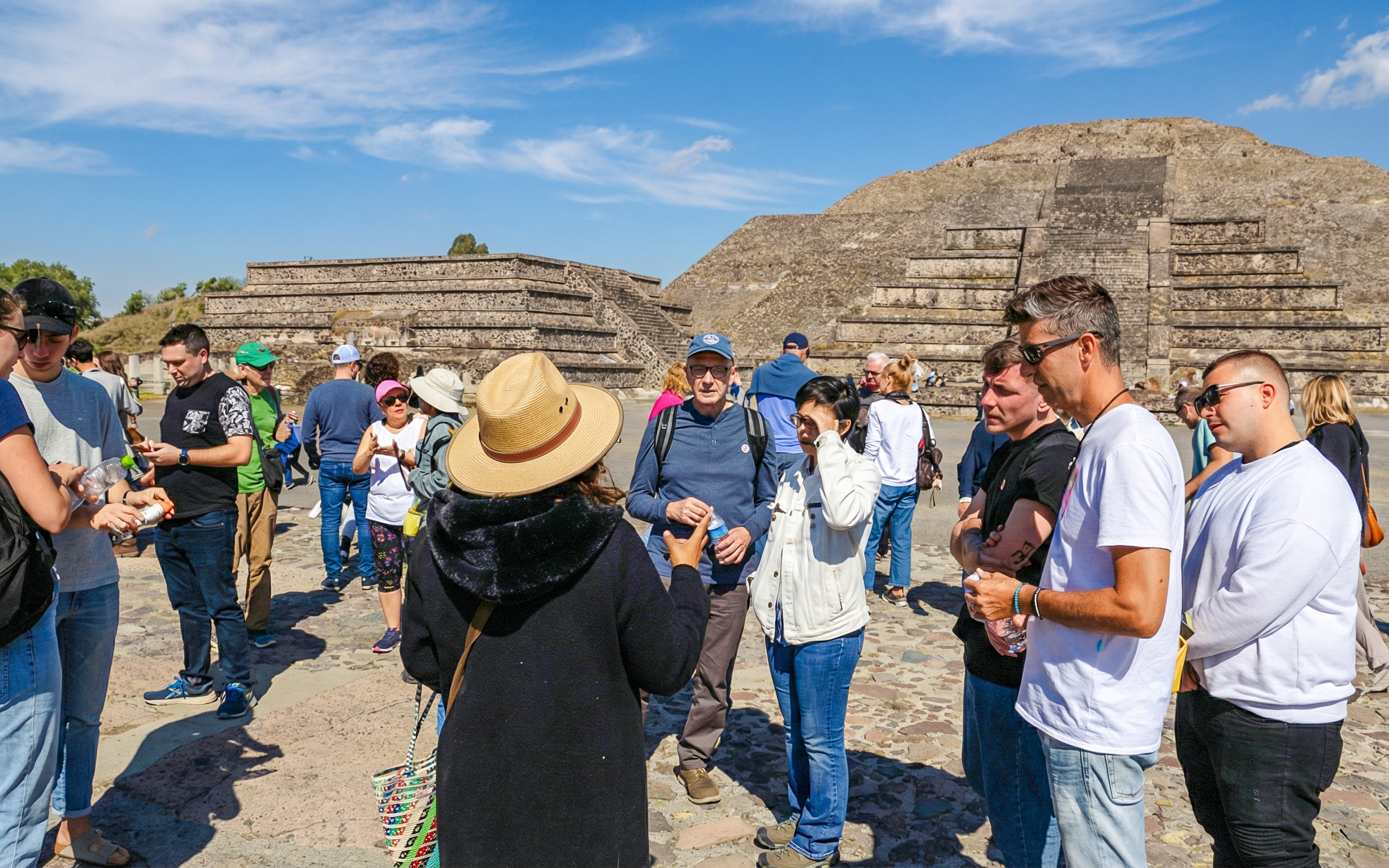 Tour group exploring Teotihuacan pyramids near Mexico City.