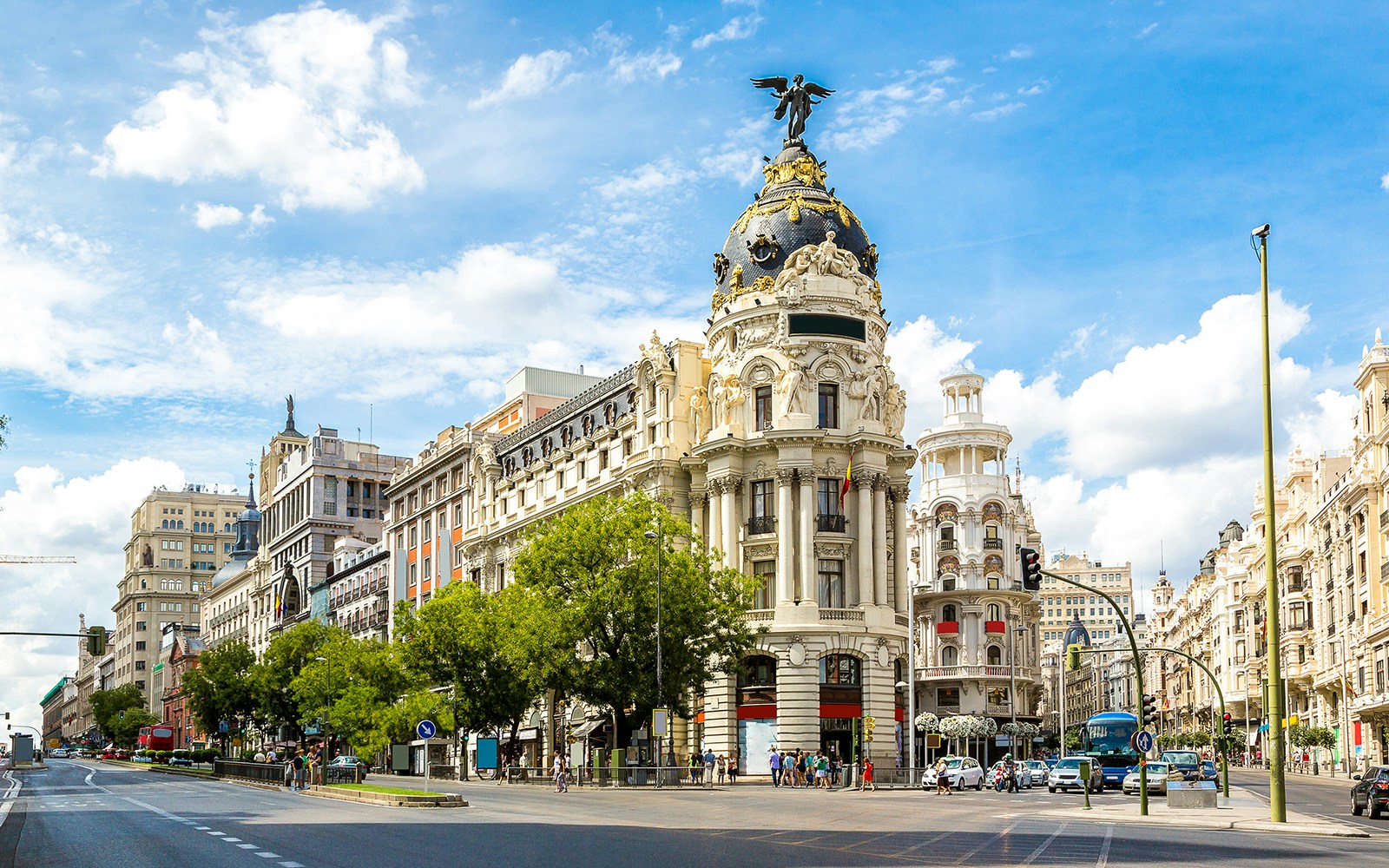 Madrid hop-on hop-off bus near Metropolis Building on Gran Via.