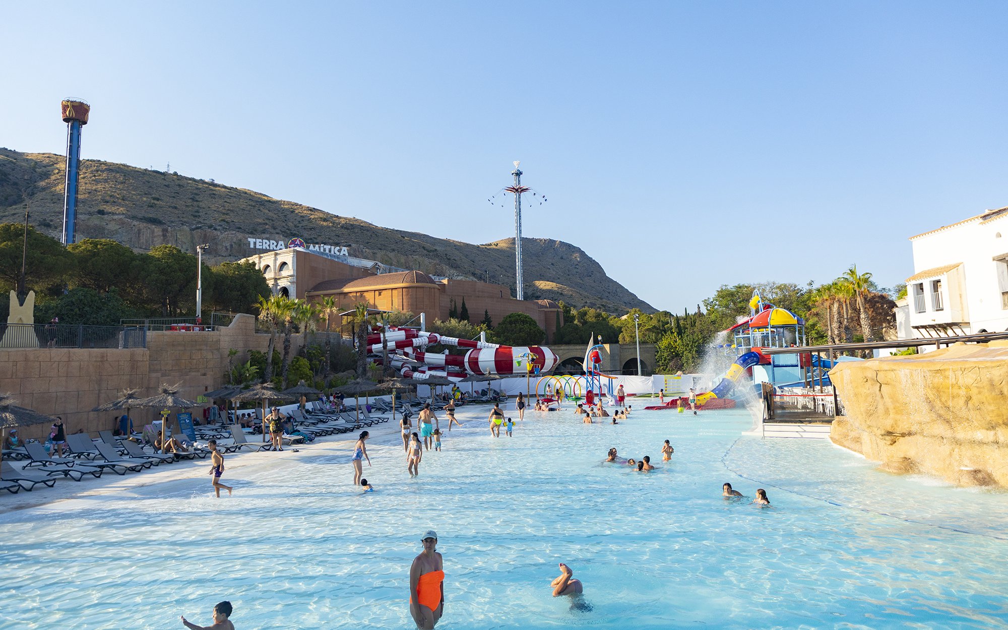 Visitors enjoying the water park at Terra Mitica Benidorm with slides and attractions.