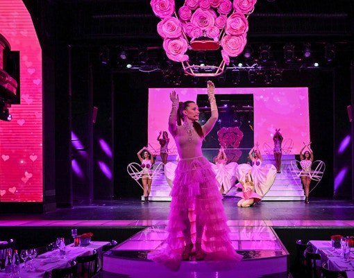 Paradis Latin cabaret show with dinner setup, Paris, Christmas Eve special.