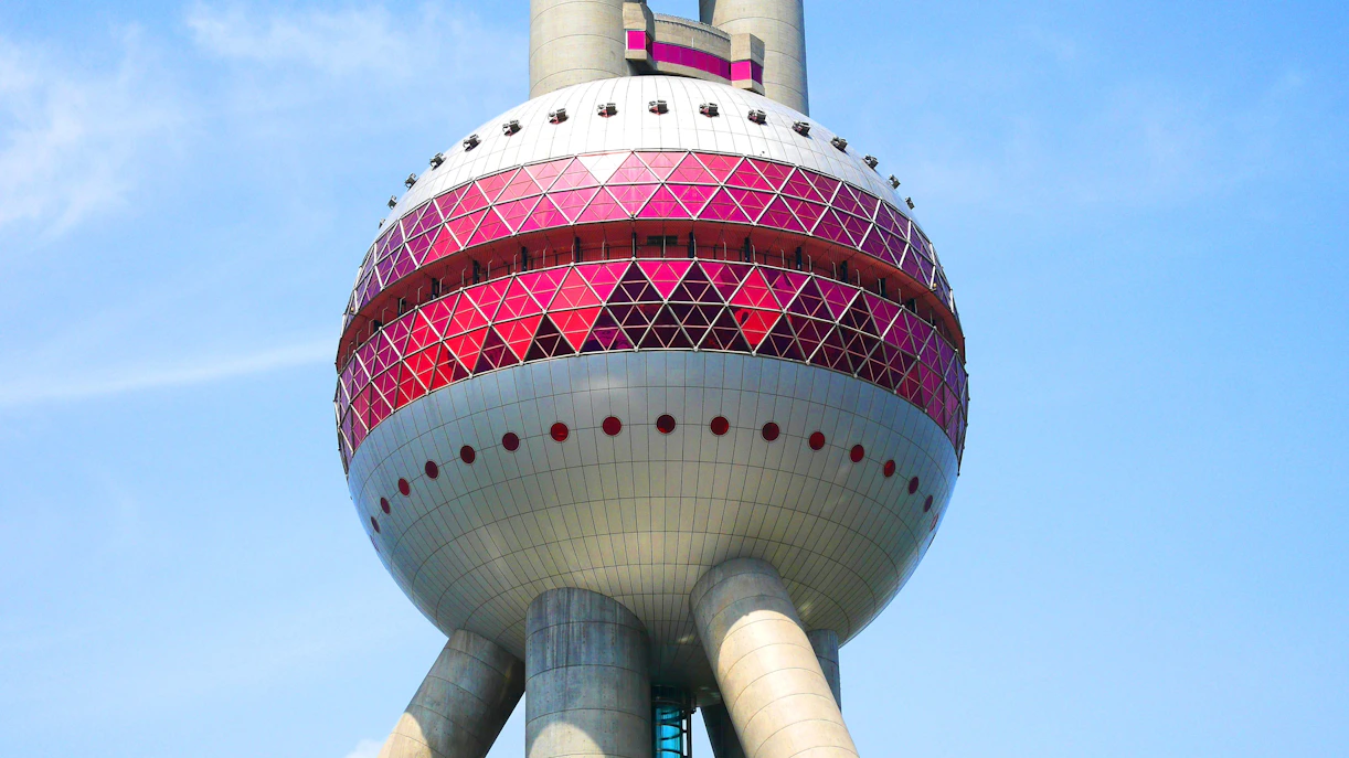 Middle sphere of the Oriental Pearl Tower in Shanghai with red geometric patterns.