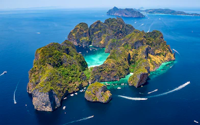 Aerial view of Phi Phi Islands with turquoise waters and lush greenery, Phuket, Thailand.