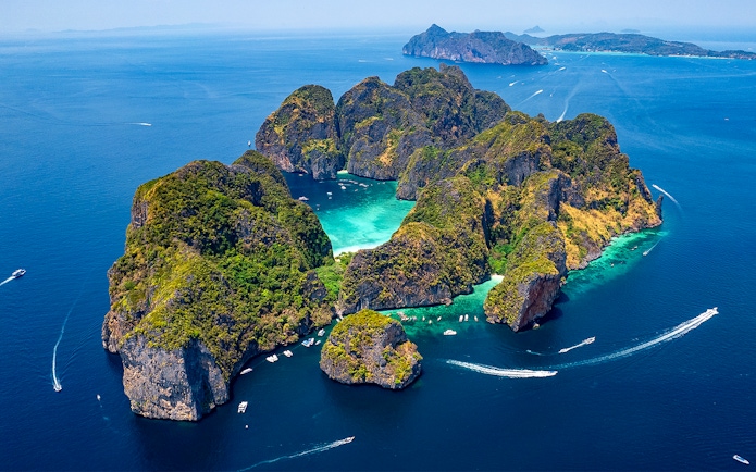 Aerial view of Phi Phi Islands with turquoise waters and lush greenery, Phuket, Thailand.