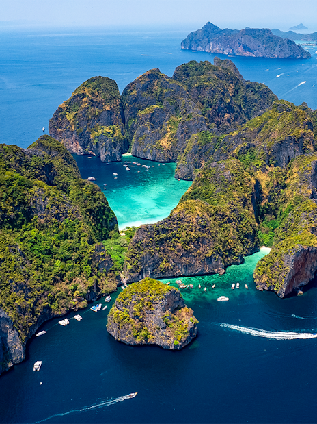 Aerial view of Phi Phi Islands with turquoise waters and lush greenery, Phuket, Thailand.