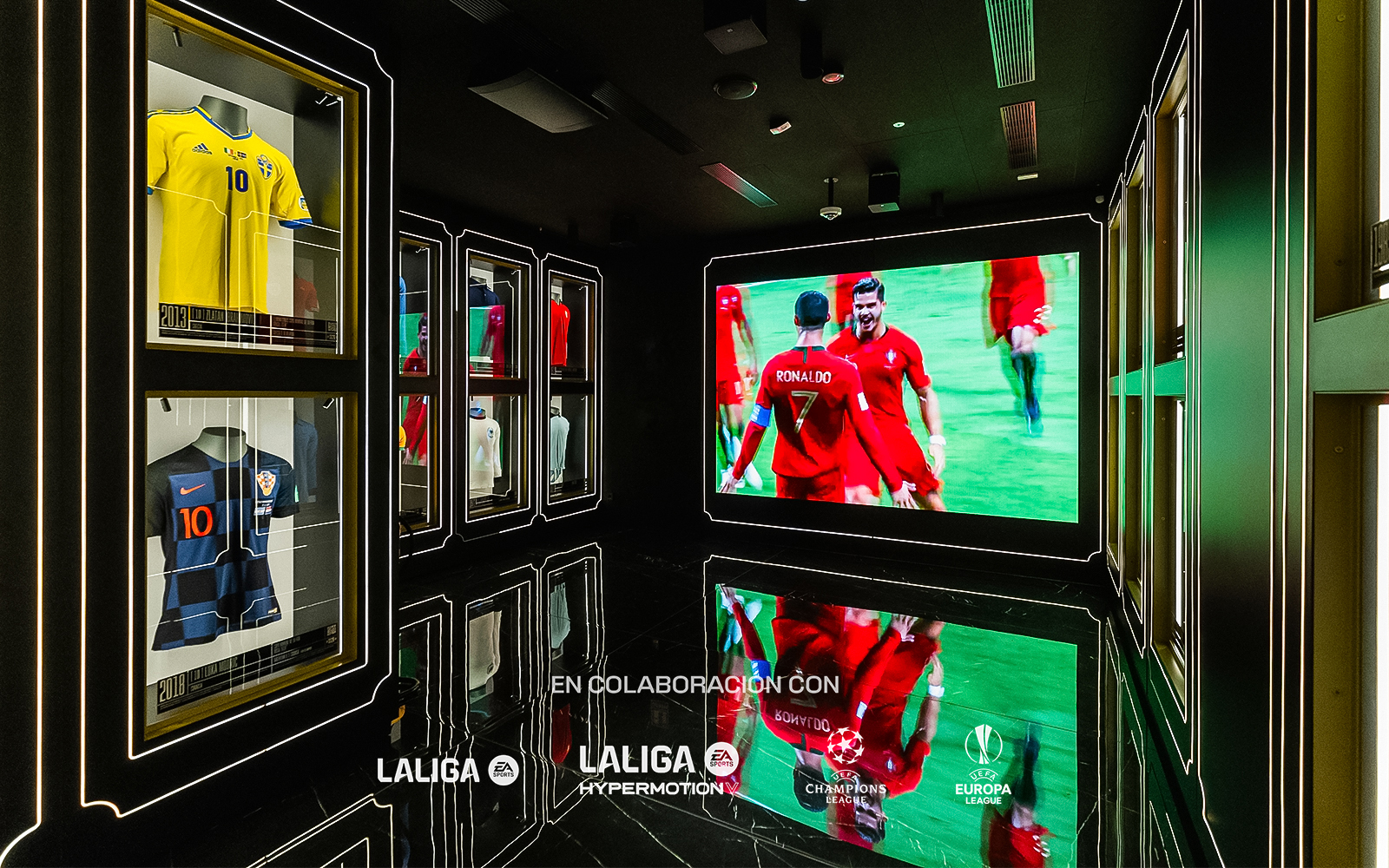 Football memorabilia display at Legends: The Home of Football Museum, featuring iconic jerseys and trophies.
